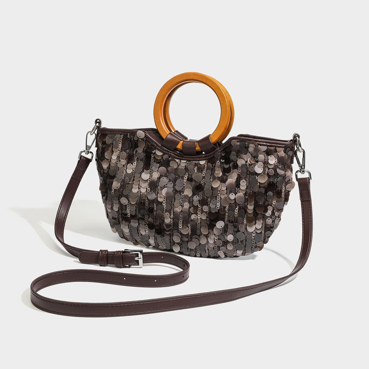 Small sequin half-moon handbag with circular wood-look ring handles and detachable leather-look shoulder strap, front view