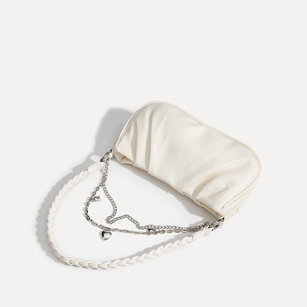 Slouchy hobo shoulder bag with gathered leather-look panels, silver-tone chain with charm pendants, and braided strap, detail