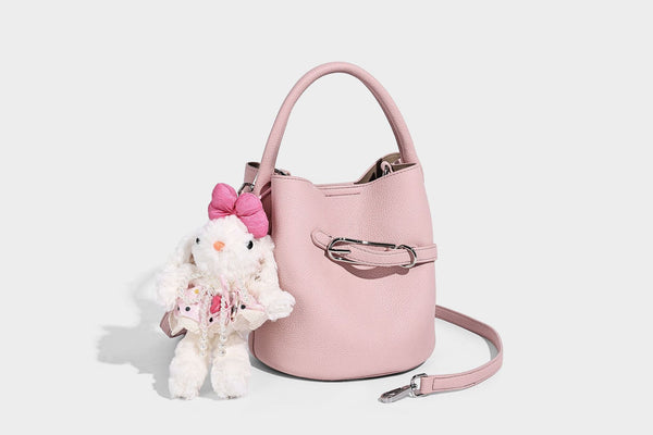 Mini pebbled leather-look bucket bag with front buckle strap, silver-tone hardware, top handle, and detachable shoulder