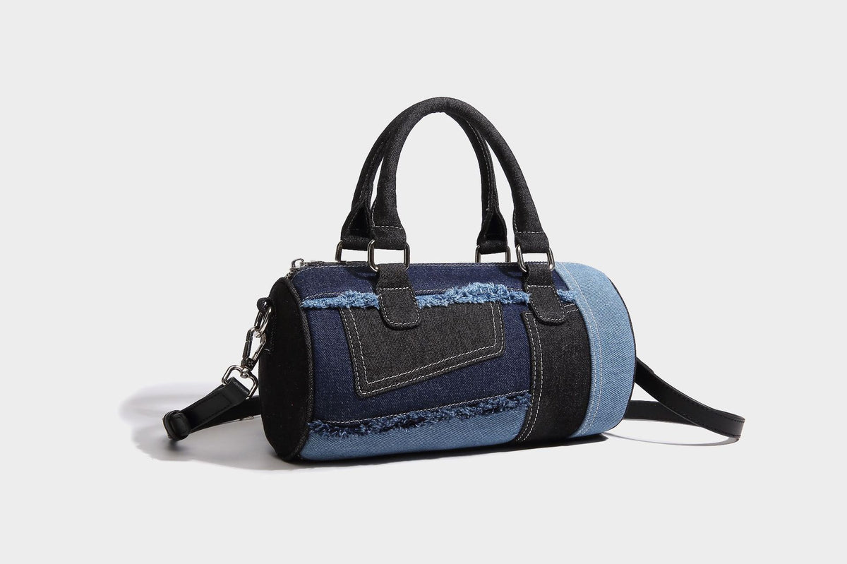 Mini barrel handbag in light and dark denim patchwork with frayed seam trim, dual top handles, top zip closure, and, detail