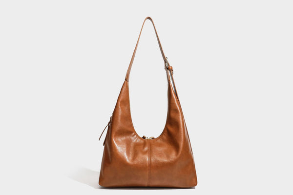 Lässig fallende Hobo-Schultertasche mit strukturierter Wildlederoptik, Reißverschluss oben, Quasten-Zippern und goldfarbenem, verstellbarem
