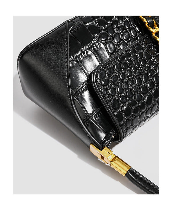 Crocodile-embossed leather-look baguette shoulder bag with gold-tone chain buckle closure and single shoulder strap, detail