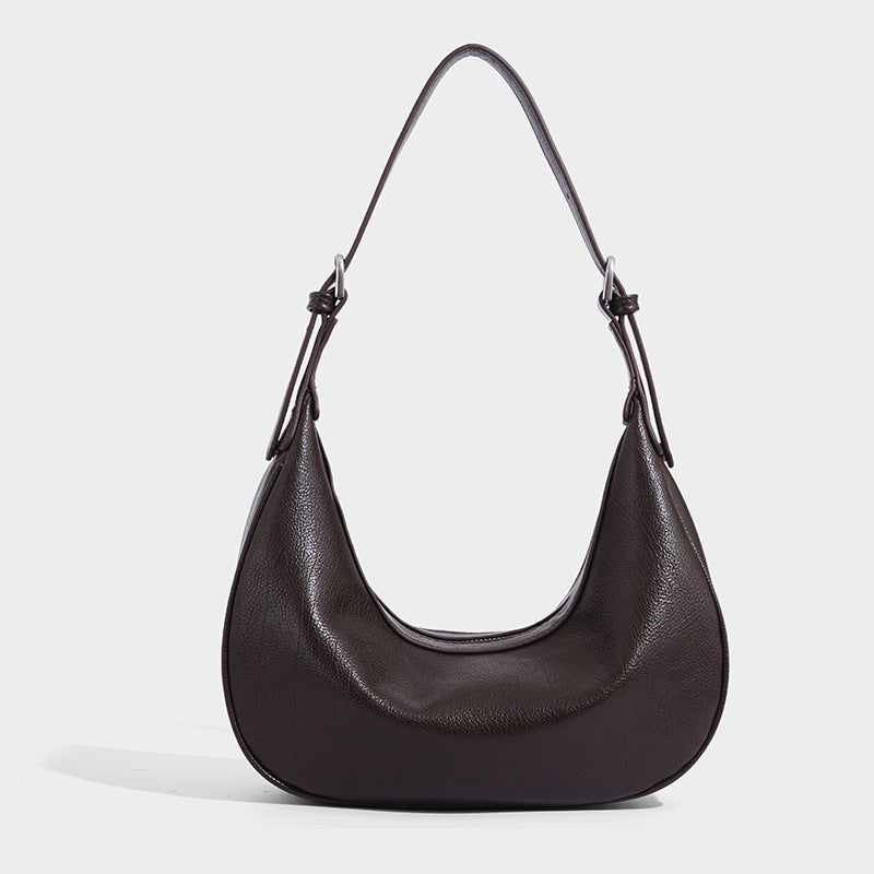 Crescent half-moon shoulder bag in pebbled leather-look finish with adjustable strap and silver-tone hardware, detail view 8