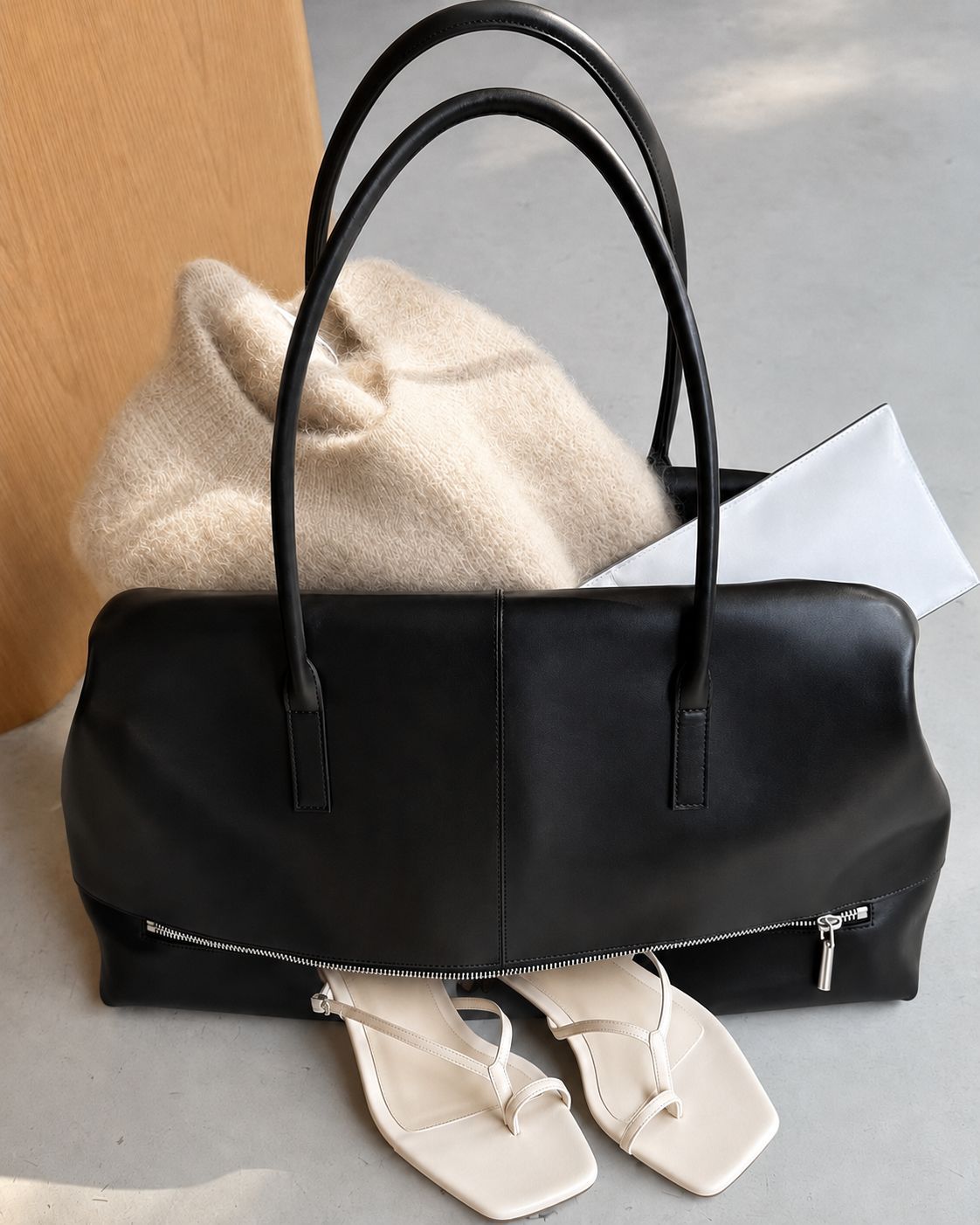 Large structured black Boston tote bag with double shoulder handles and full-length front zipper compartment, detail view 16