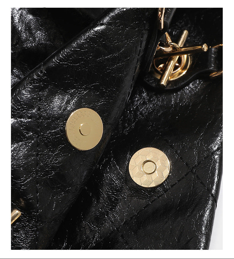 Quilted crinkled leather-look convertible tote backpack with gold-tone chain handles and drawstring closure, detail view 12