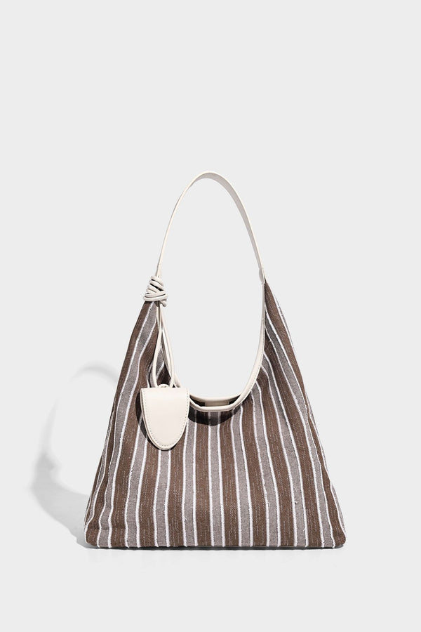 Slouchy striped canvas hobo shoulder bag with cream trim and long knotted strap, detail view 8
