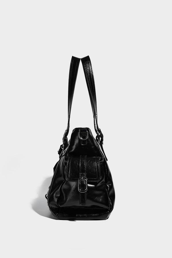 Glossy structured black tote shoulder bag with silver buckle hardware, zip pockets, dual top handles, and detachable, detail