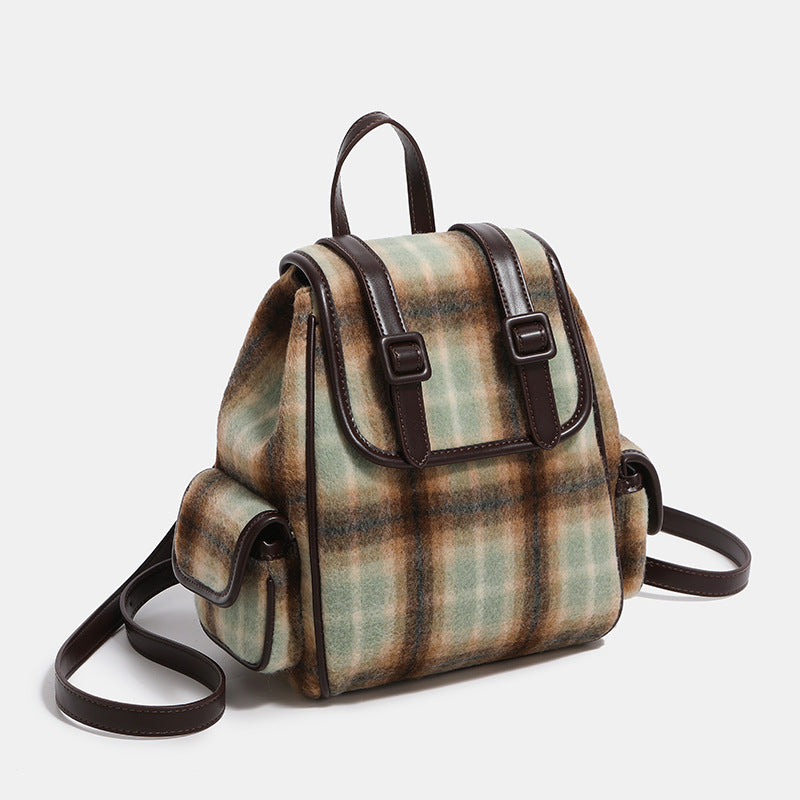 Compact vintage plaid backpack in khaki and sage check with dark leather-look trim, buckle flap closure, and adjustable