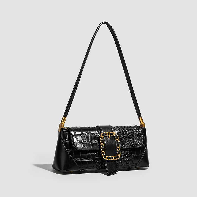 Crocodile-embossed leather-look baguette shoulder bag with gold-tone chain buckle closure and single shoulder strap, detail