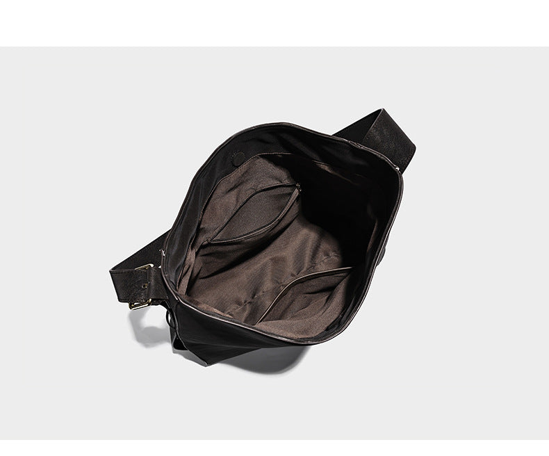 Large slouchy hobo shoulder bag in matte leather-look finish with adjustable strap and gold-tone bar hardware, detail view 9