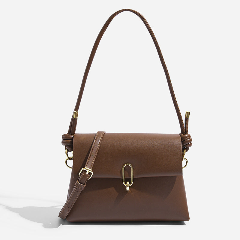 Mini structured flap crossbody bag with gold-tone oval clasp and adjustable strap, front view