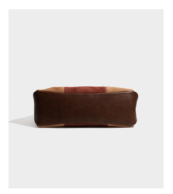 Patchwork suede-look barrel shoulder bag in brown, rust, tan, beige, and gray panels with double leather-look straps and