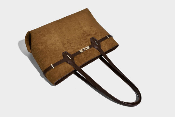 Structured suede-look shopper tote with wraparound belt strap and gold turn-lock clasp, long dark brown shoulder handles