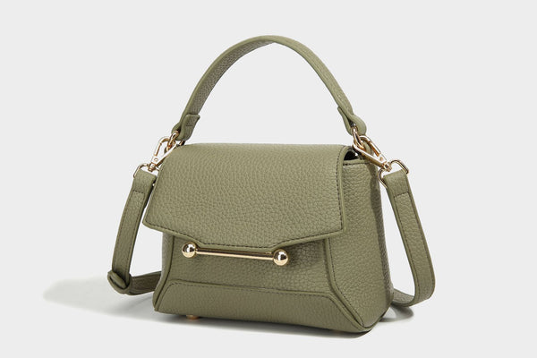 Small structured pebbled flap mini satchel with gold-tone bar hardware, short top handle, and detachable crossbody strap