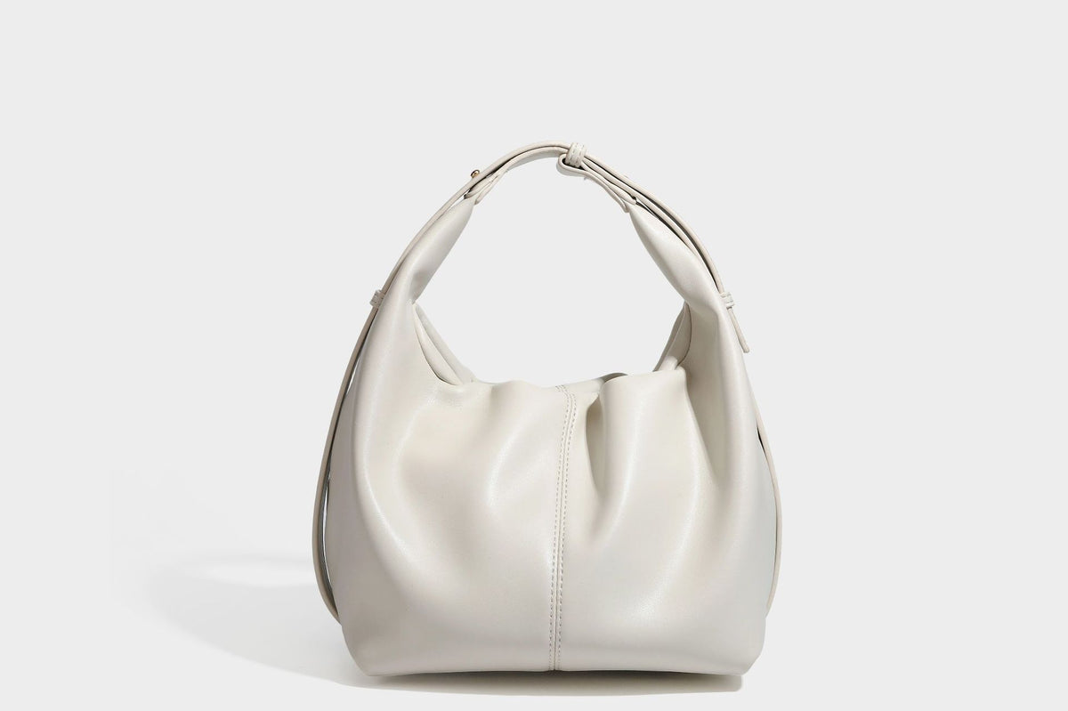 Slouchy hobo bag with smooth leather-look finish, drawstring cinch closure, and gold-tone bead hardware, detail view 23