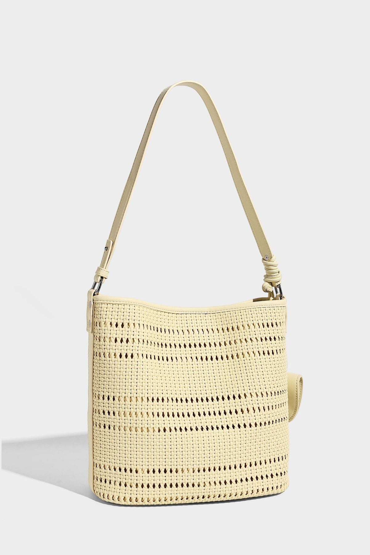 Handwoven open-weave shoulder bag with leather-look trim, knotted adjustable strap, and clip-on sunglasses sleeve pouch