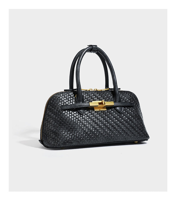 Structured woven-embossed leather-look satchel with dual rolled top handles, gold-tone turn-lock closure, and detachable