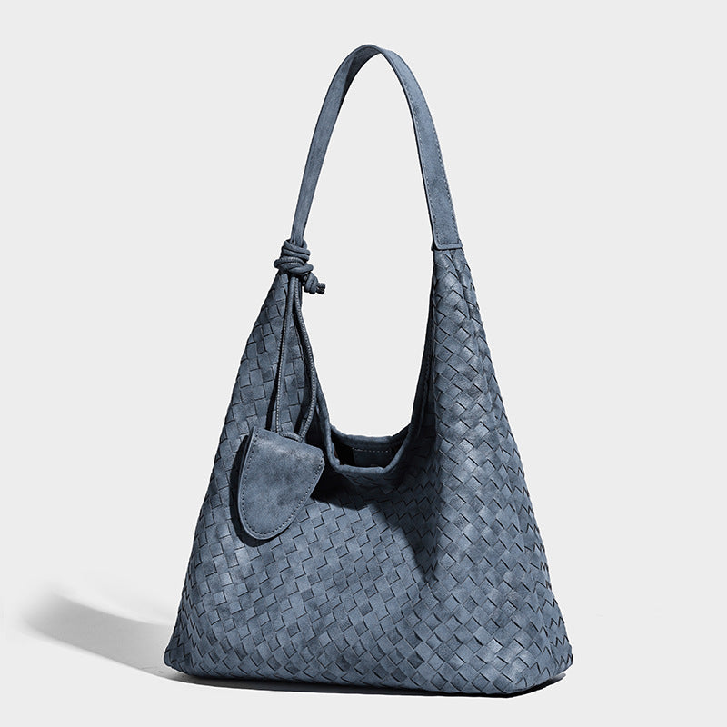 Slouchy woven hobo shoulder bag with knotted strap and matte leather-look textured finish, detail view 8