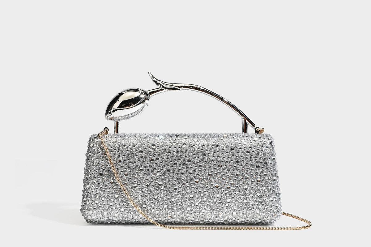 rectangular hard-case rhinestone evening clutch with sculptural gold-tone branch-and-bud top handle and detachable chain