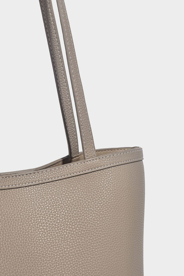 Structured pebbled leather-look tote bag in taupe with long shoulder strap, detachable zip pouch, and pink tulip flower