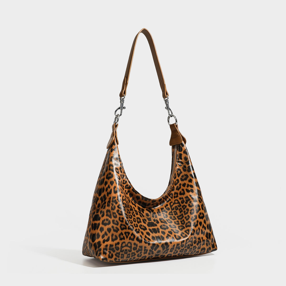Slouchy hobo shoulder bag in glossy leopard-print leather-look finish with zip-top closure and silver-tone clip hardware