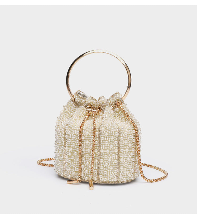 Small pearl-beaded drawstring bucket bag with silver-tone ring top handle and chain shoulder strap, detail view 19