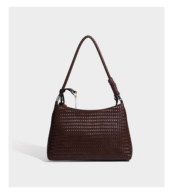 Woven-texture hobo shoulder bag in brown with braided top handle, adjustable crossbody strap, front flap pocket, and, detail