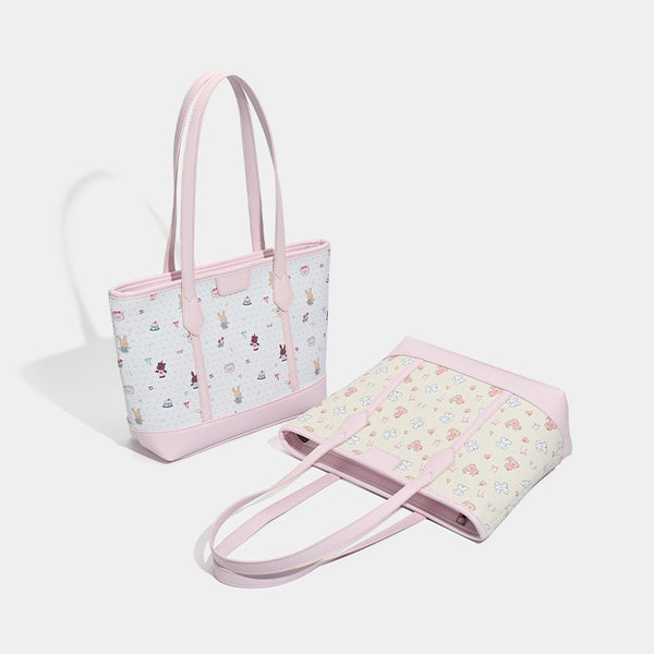 Große, strukturierte Tote-Bag mit Reißverschluss oben, Einsätzen mit pastellfarbenem Cartoon-Print, glattem Besatz in rosafarbener Lederoptik und zwei Schulterriemen