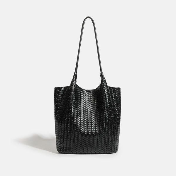 Large woven textured tote bag with long shoulder straps and structured rectangular base, detail view 8