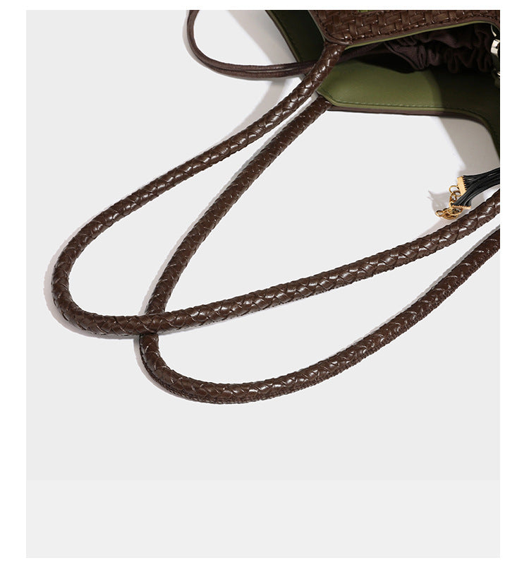 Woven tote bag with braided shoulder straps, drawstring closure, and dangling metal-and-bead charm, detail view 26