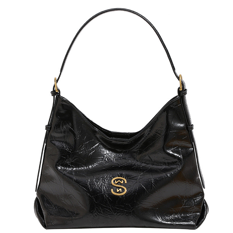 Glossy crinkled hobo shoulder bag with gold-tone logo hardware and adjustable strap, detail view 5
