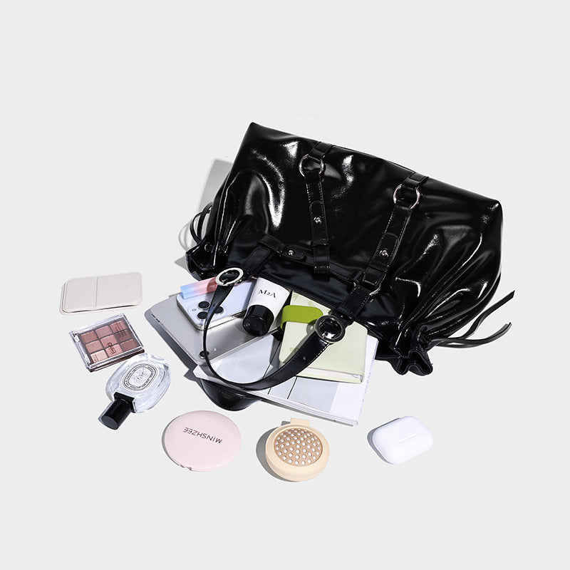Glossy patent-look slouchy tote bag with ruched drawstring sides, dual top handles, silver ring hardware, and detachable