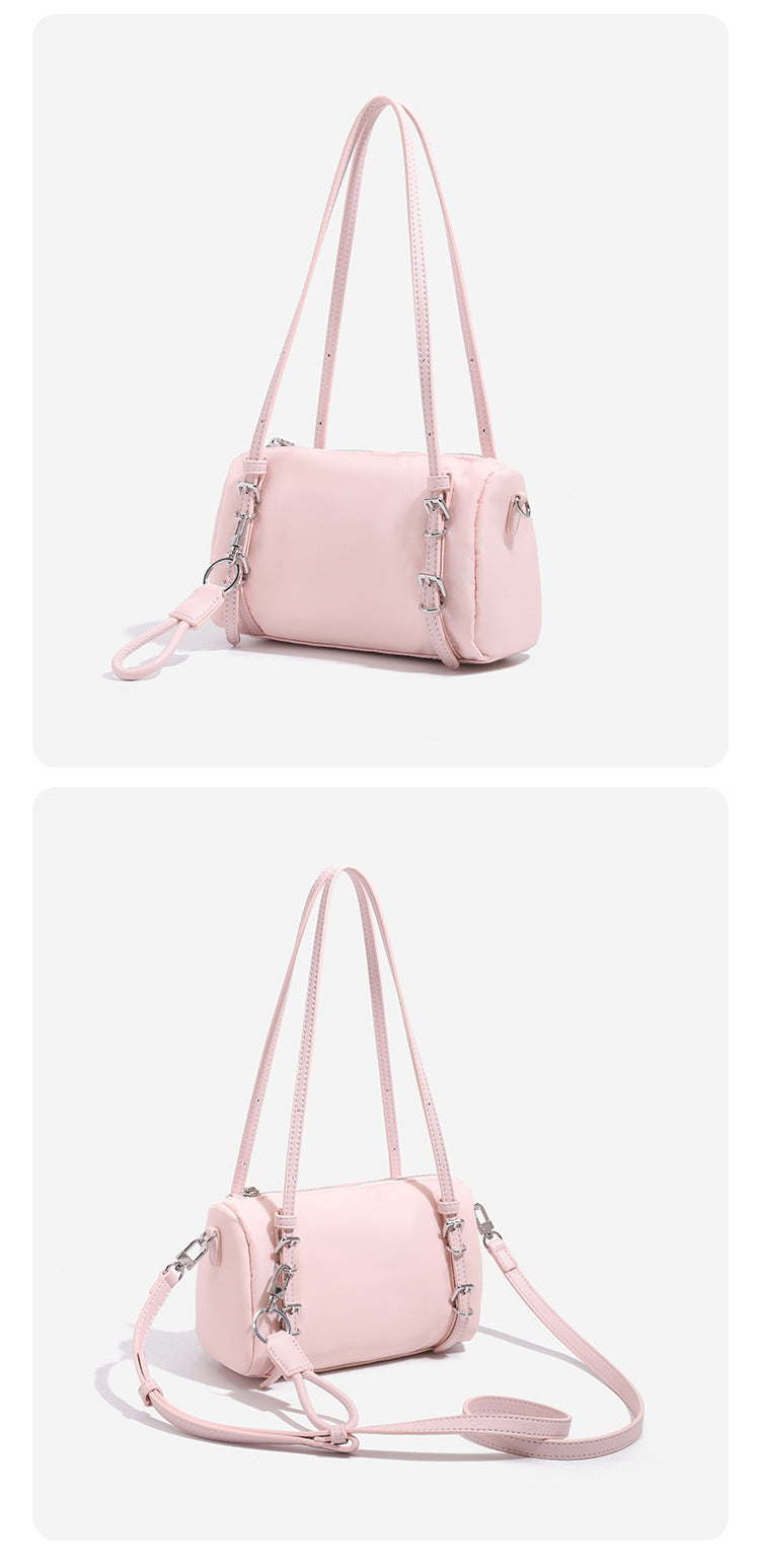Compact nylon Boston barrel bag with zip-top closure, silver-tone hardware, dual slim handles, and detachable crossbody