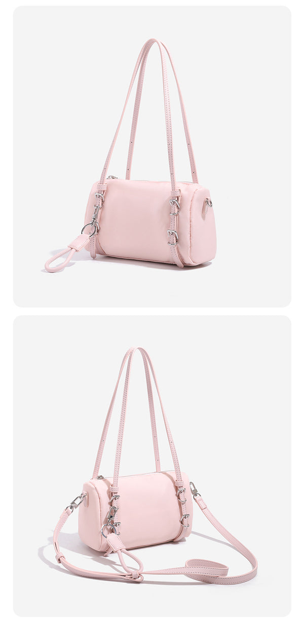Compact nylon Boston barrel bag with zip-top closure, silver-tone hardware, dual slim handles, and detachable crossbody
