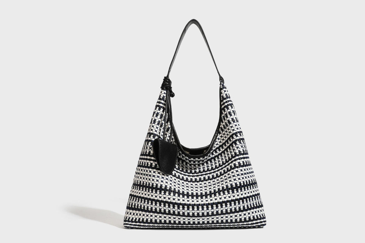 Slouchy woven stripe hobo shoulder bag with black-and-white pattern and leather-look strap, detail view 22