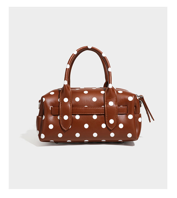 Kleine, strukturierte Mini-Henkeltasche mit Polka-Dot-Muster, Sternanhänger, Schnallriemen-Detail auf der Vorderseite, zwei Henkeln und abnehmbarem