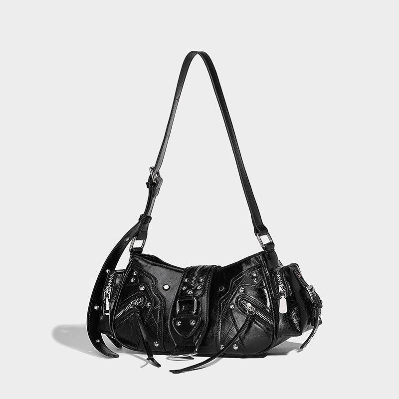 Compact glossy leather-look crossbody bag with silver studs, buckle hardware, and multiple zip pockets, detail view 16