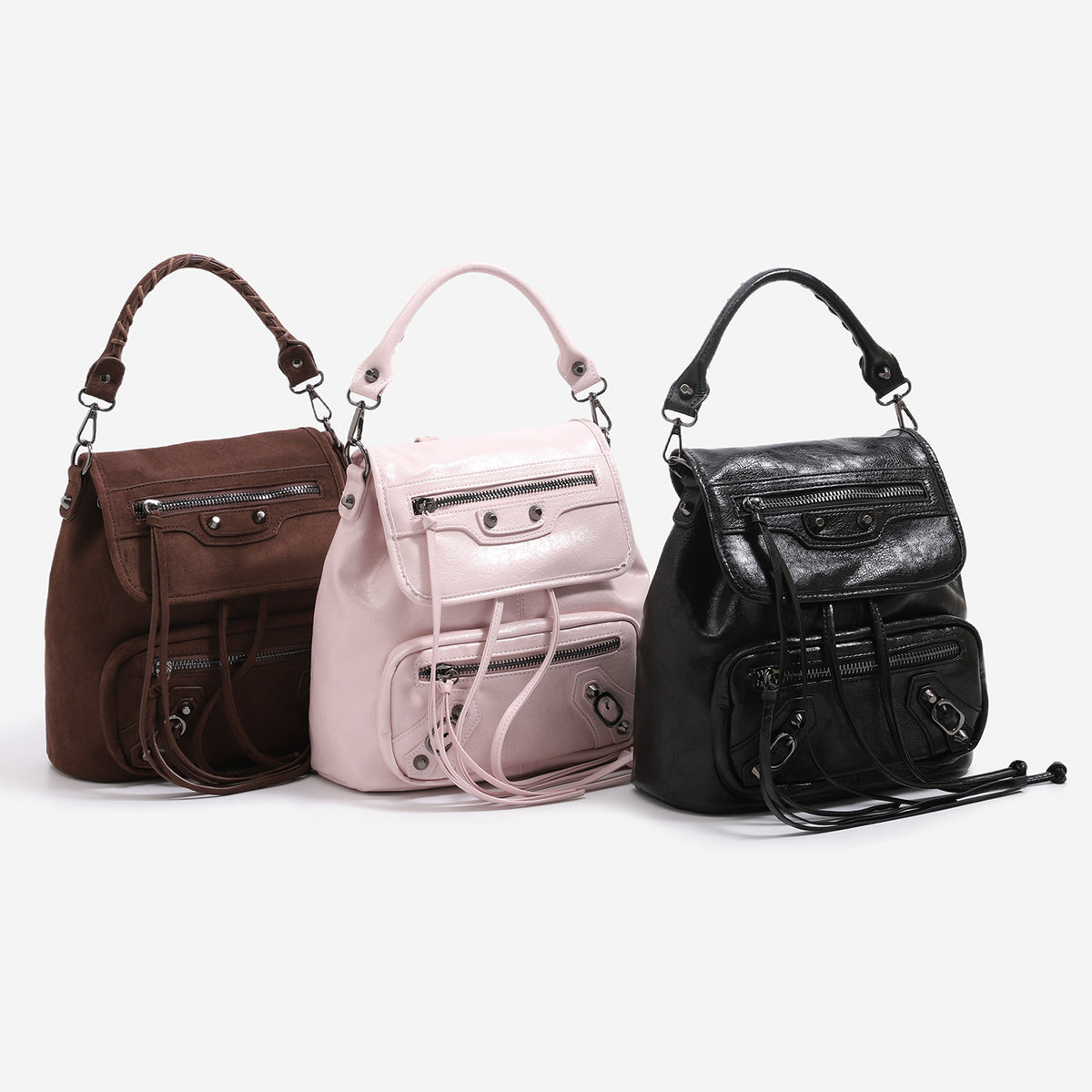 Mini flap backpack handbag with silver stud hardware, front zip pockets, and drawstring tassels, detail view 2