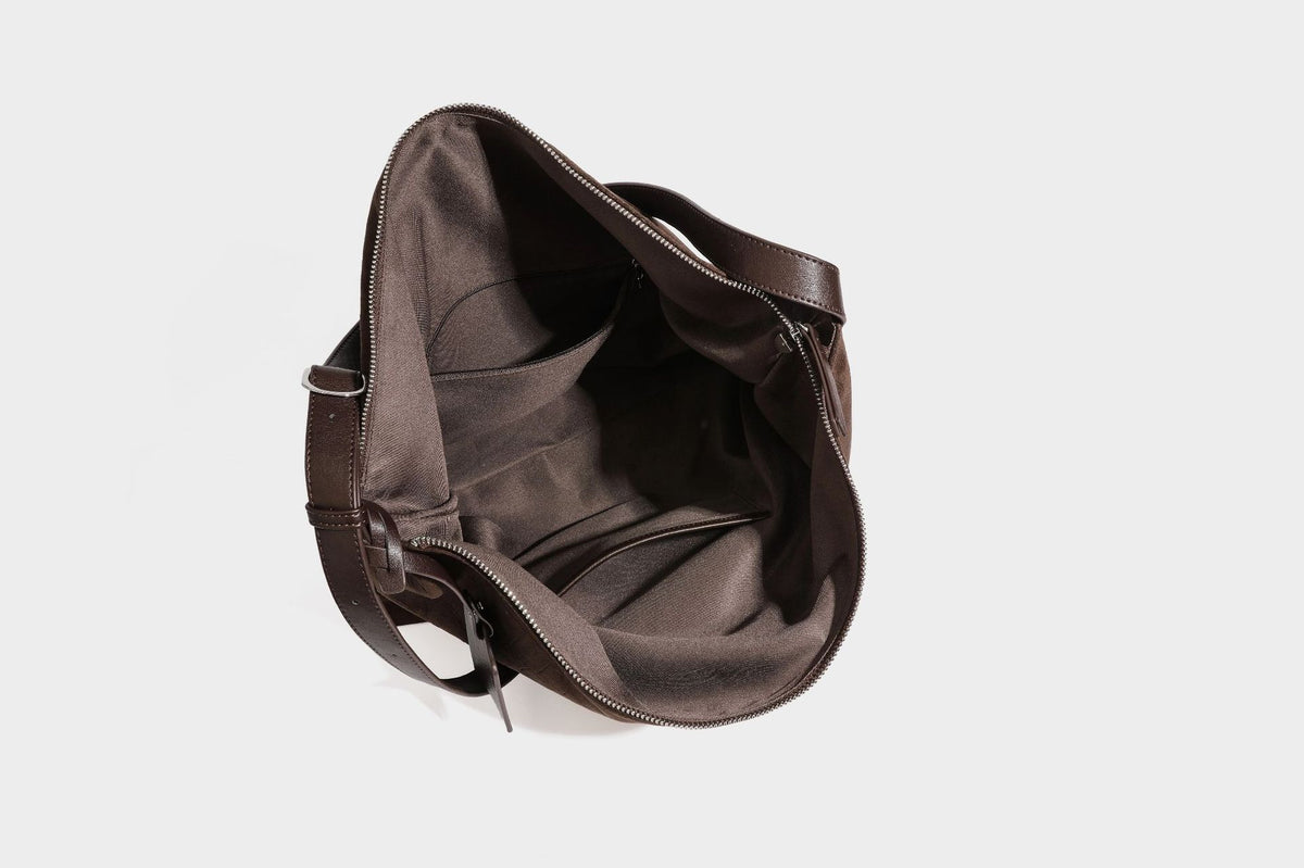 Slouchy hobo shoulder bag in matte croc-embossed leather-look finish with top zip closure and long adjustable strap, detail