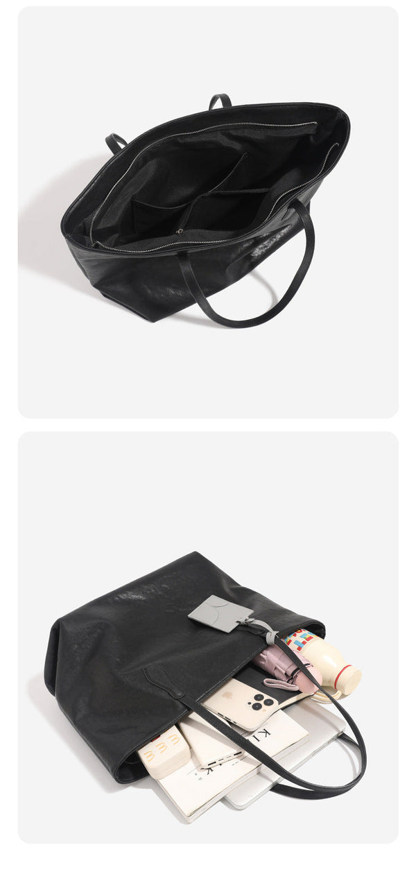 Oversized slouchy leather-look tote bag with long shoulder straps, contrast grey hanging tag, and silver-tone hardware