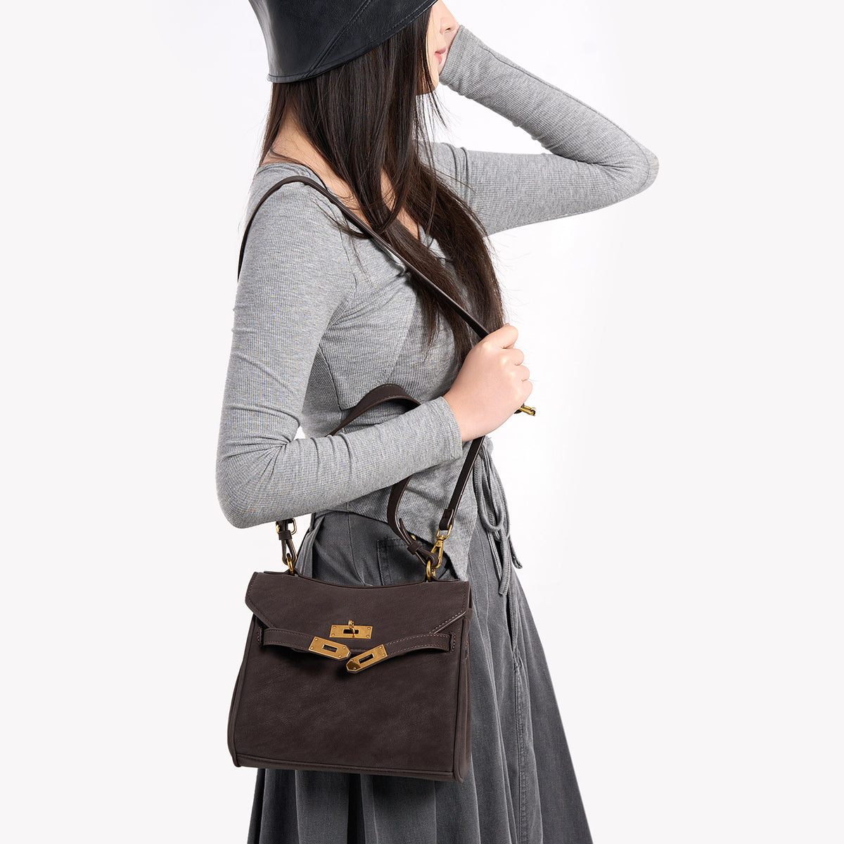 Structured dark brown flap satchel with gold-tone turn-lock hardware and detachable shoulder strap, detail view 3