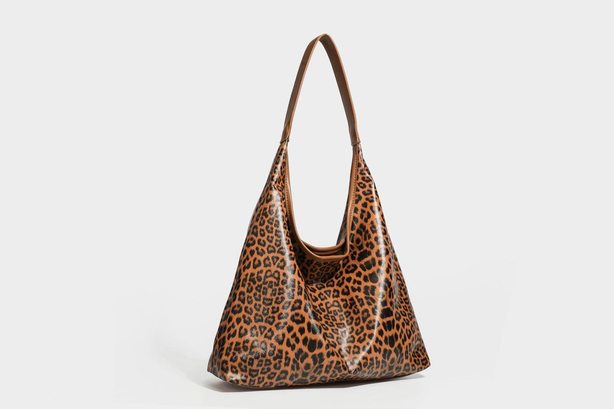 Glossy leopard-print slouchy shoulder bag with long strap and detachable tan zip pouch, detail view 24