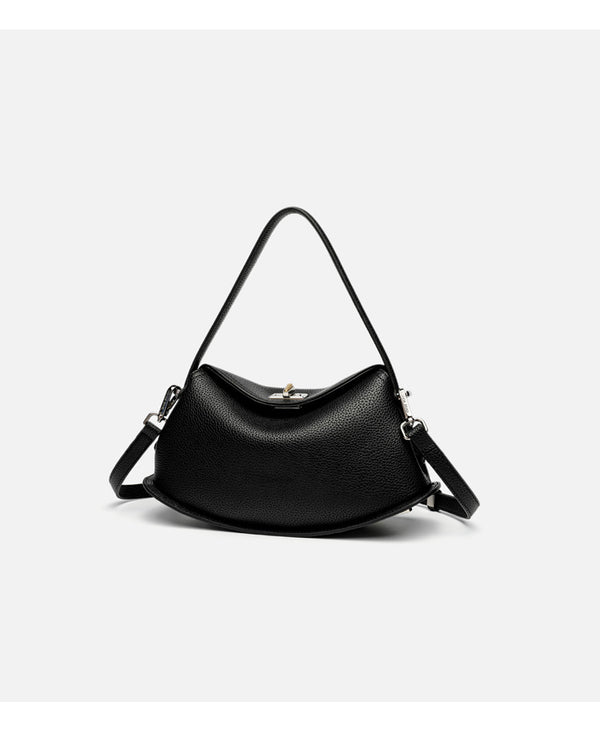 Pebbled leather-look half-moon saddle bag with turn-lock flap closure, top handle, and detachable crossbody strap, detail