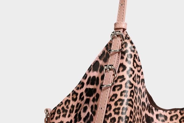 Large leopard print shoulder tote bag with glossy finish, long double straps, front zip pocket, silver-tone hardware, and