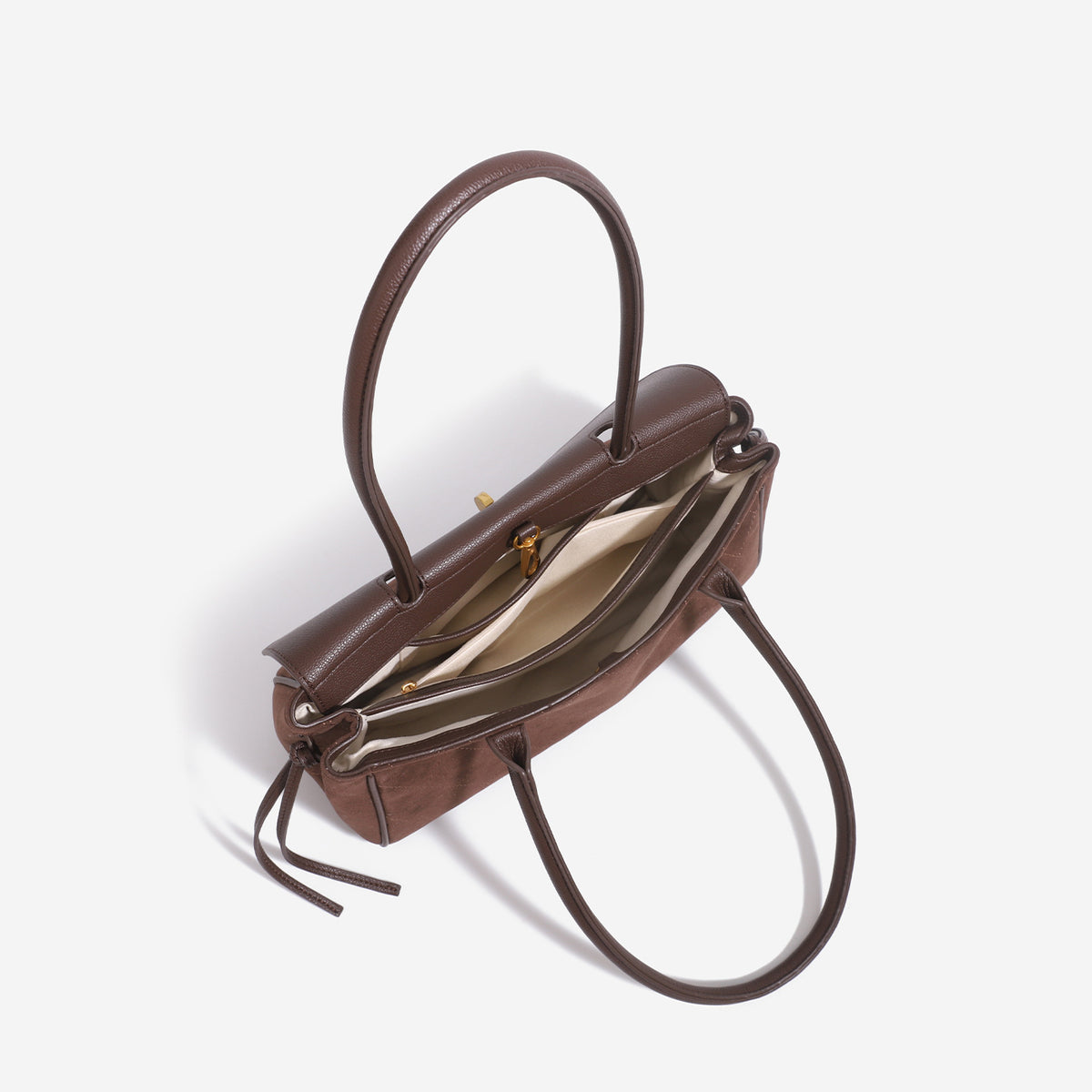 Structured rectangular baguette shoulder bag with diamond quilted lower panel, smooth flap, gold-tone turn-lock closure