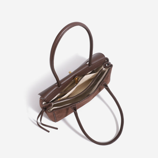 Structured rectangular baguette shoulder bag with diamond quilted lower panel, smooth flap, gold-tone turn-lock closure