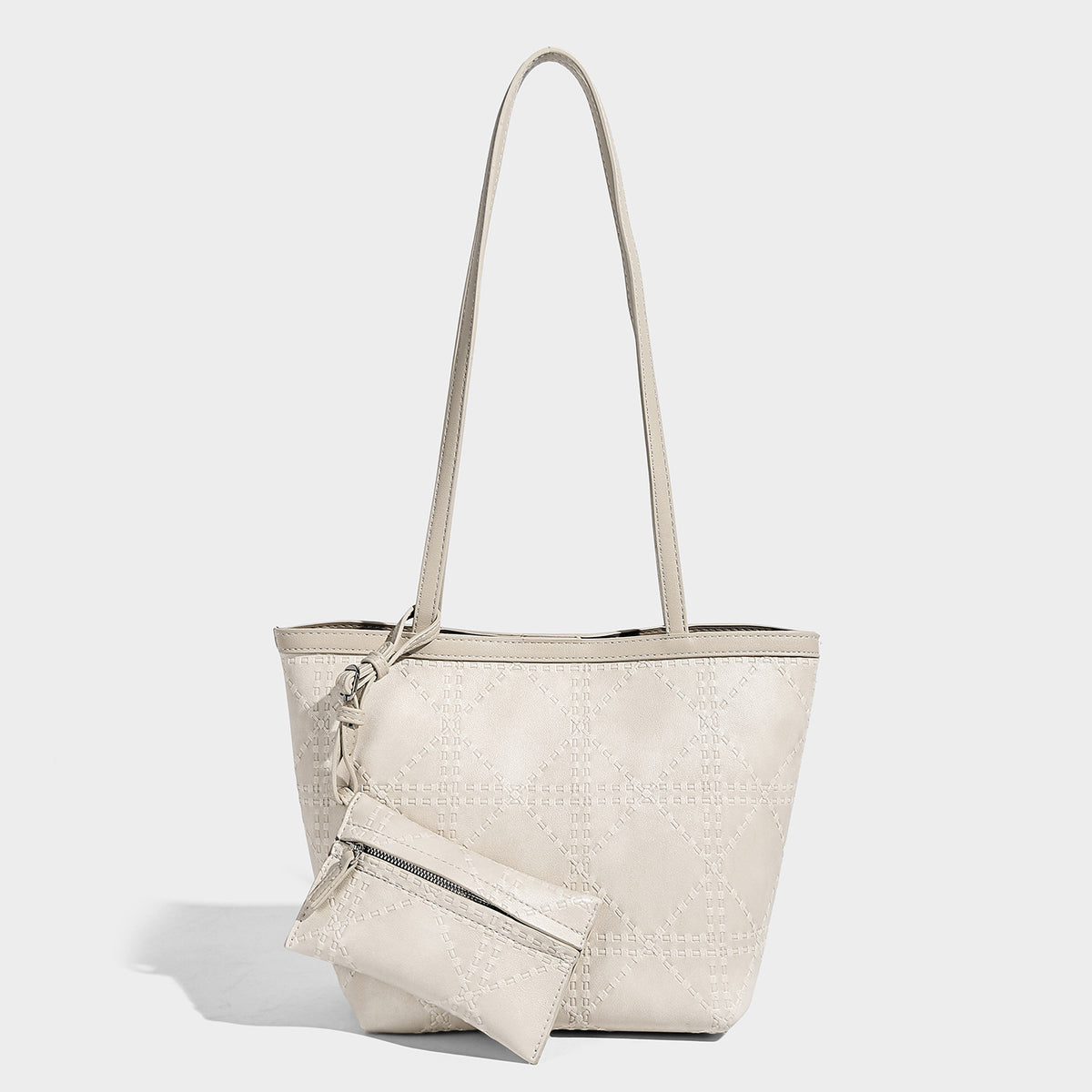 Quilted diamond-pattern tote bag with attached front zip pouch and long shoulder straps, detail view 6