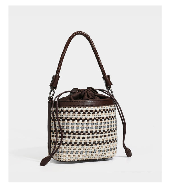 Small structured woven checker bucket bag with braided top handle, drawstring closure, and silver-tone hardware in black