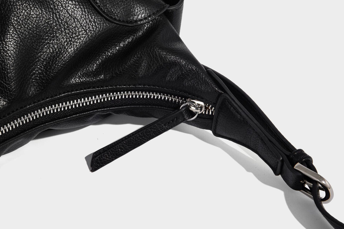 Soft pebbled leather-look hobo shoulder bag with zip top closure, side flap pockets, and silver-tone hardware, detail view 21