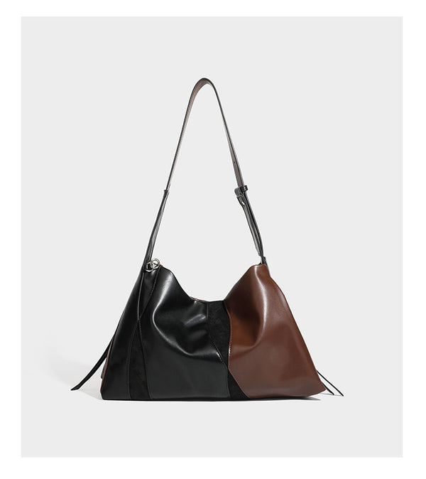 Two-tone black and brown leather-look slouchy shoulder bag with beaded tassel charm and silver-tone hardware, detail view 10